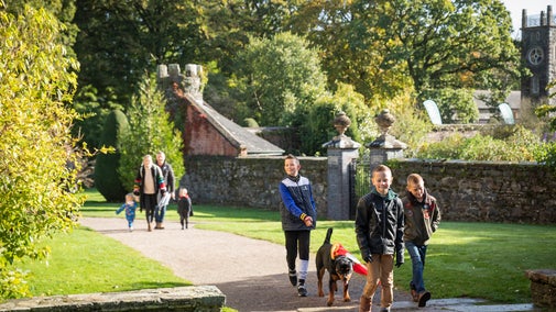 Family walking around the grounds of Rowallane Garden